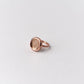A ROHO Heritage Jewellery fingerprint impression ring in rose gold, displayed on a clean white bakcground.