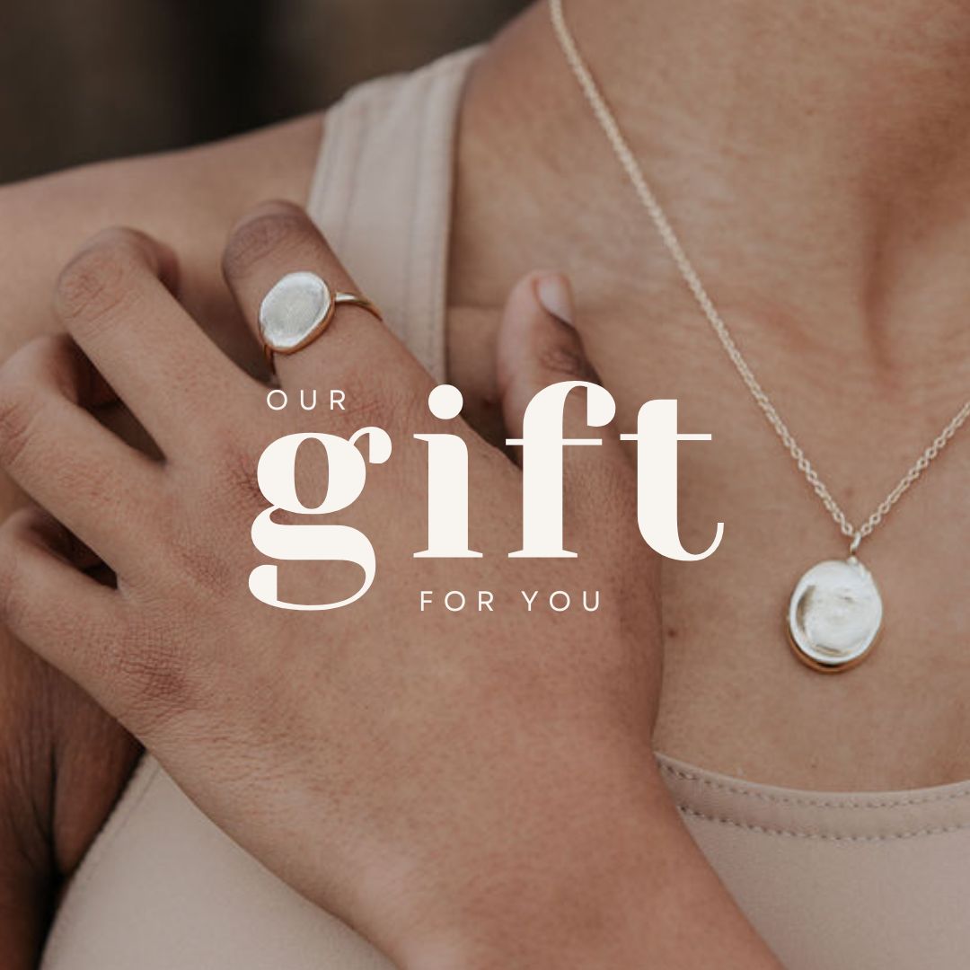 An image of a gift card. The text reads "our gift for you", over a background close-up image of a lady wearing a ROHO Heritage Jewellery pendant and ring. 